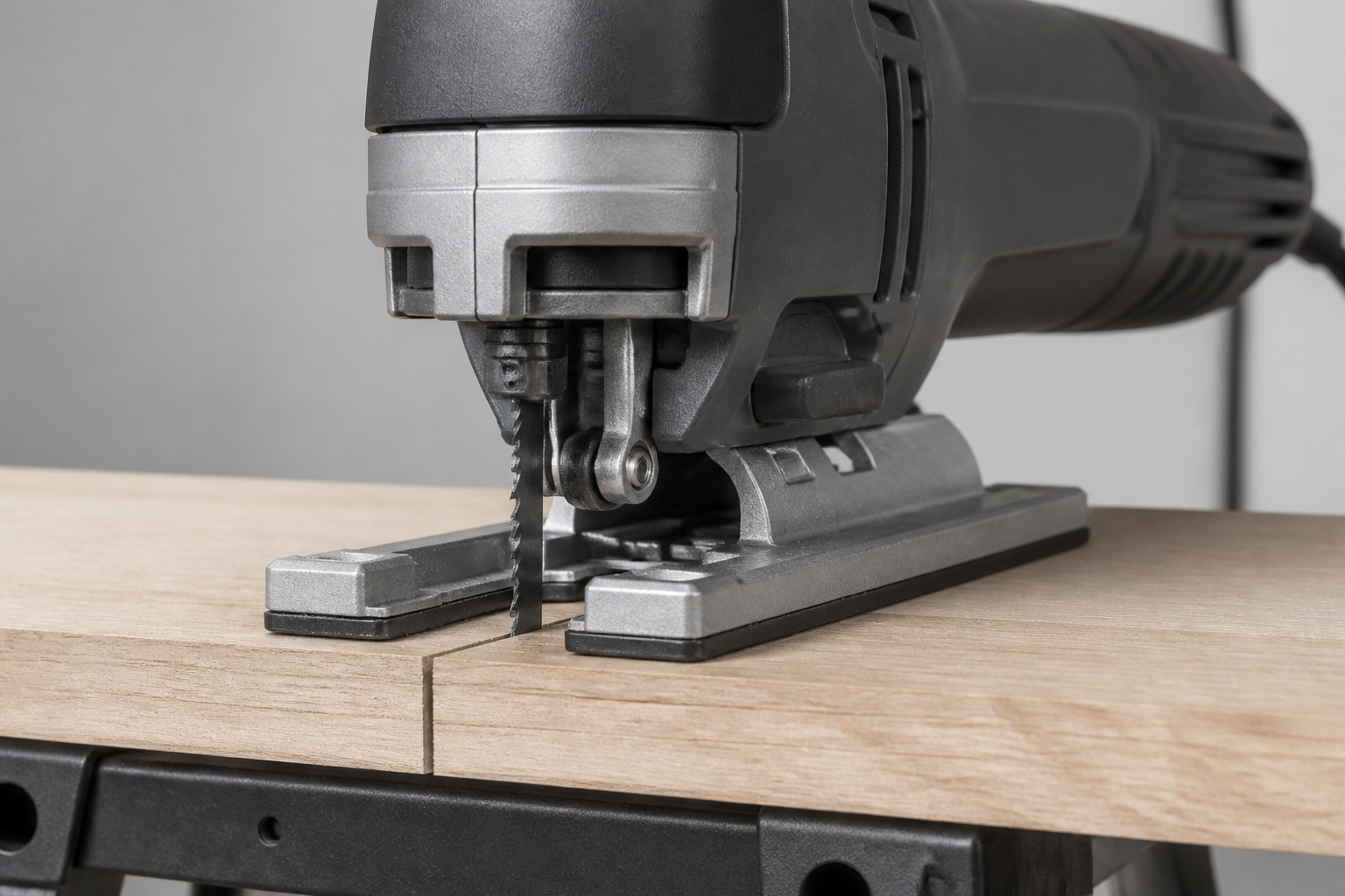 Generic jigsaw inspection view showing the blade clamp, front blade path, and supported workpiece