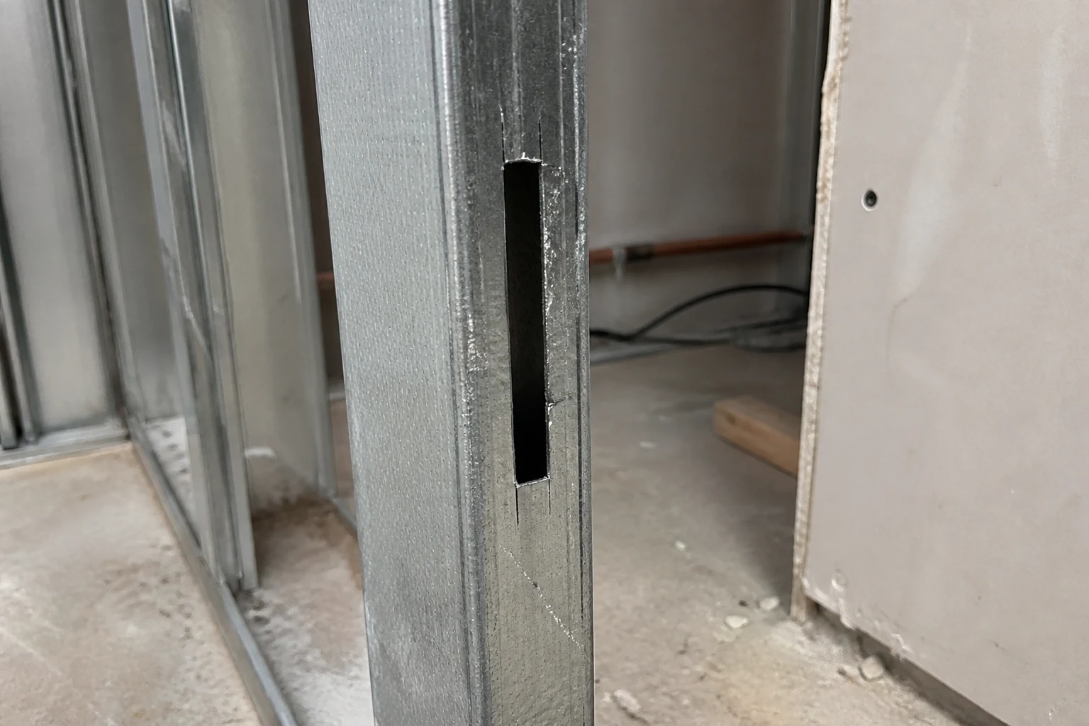 Metal stud slot cut with a bi-metal reciprocating saw blade after wood blocking